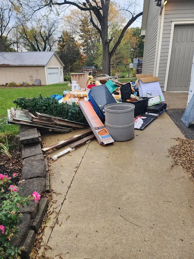 Dumpster being loaded with debris for Residential Dumpster Rental in Harriman